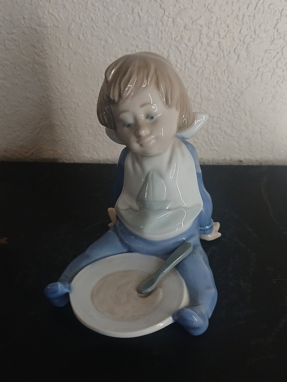Porcelain Child Figurine in Blue and Cream Decorative Accent